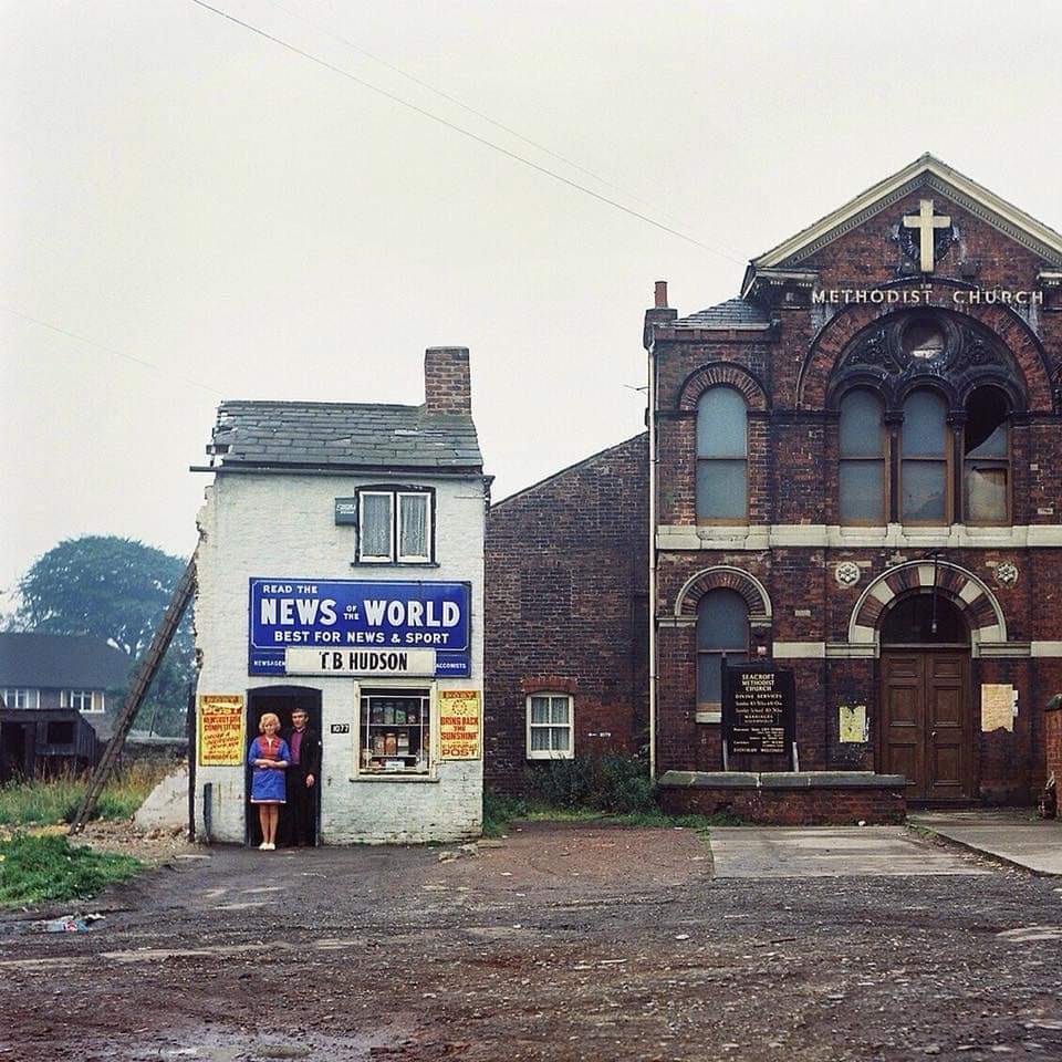 Mr & Mrs Hudson outside their Newsagents, Seacroft, Leeds, 1974. 
📸  Peter Michael