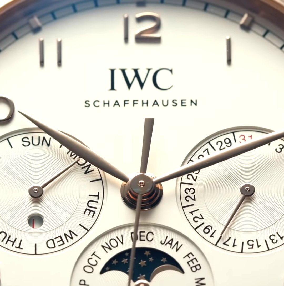 The IWC Portugieser Perpetual Calendar 42 ~ Functions: Perpetual Calendar ~ Case: 42.4mm – Gold – 13.8mm Thick ~ Water Resistance: 30M ~ Movement ( Calibre 82650) 60-Hour Power Reserve – Automatic –28,800 vph Frequency – 46 Jewels ~ MSRP: £29,900