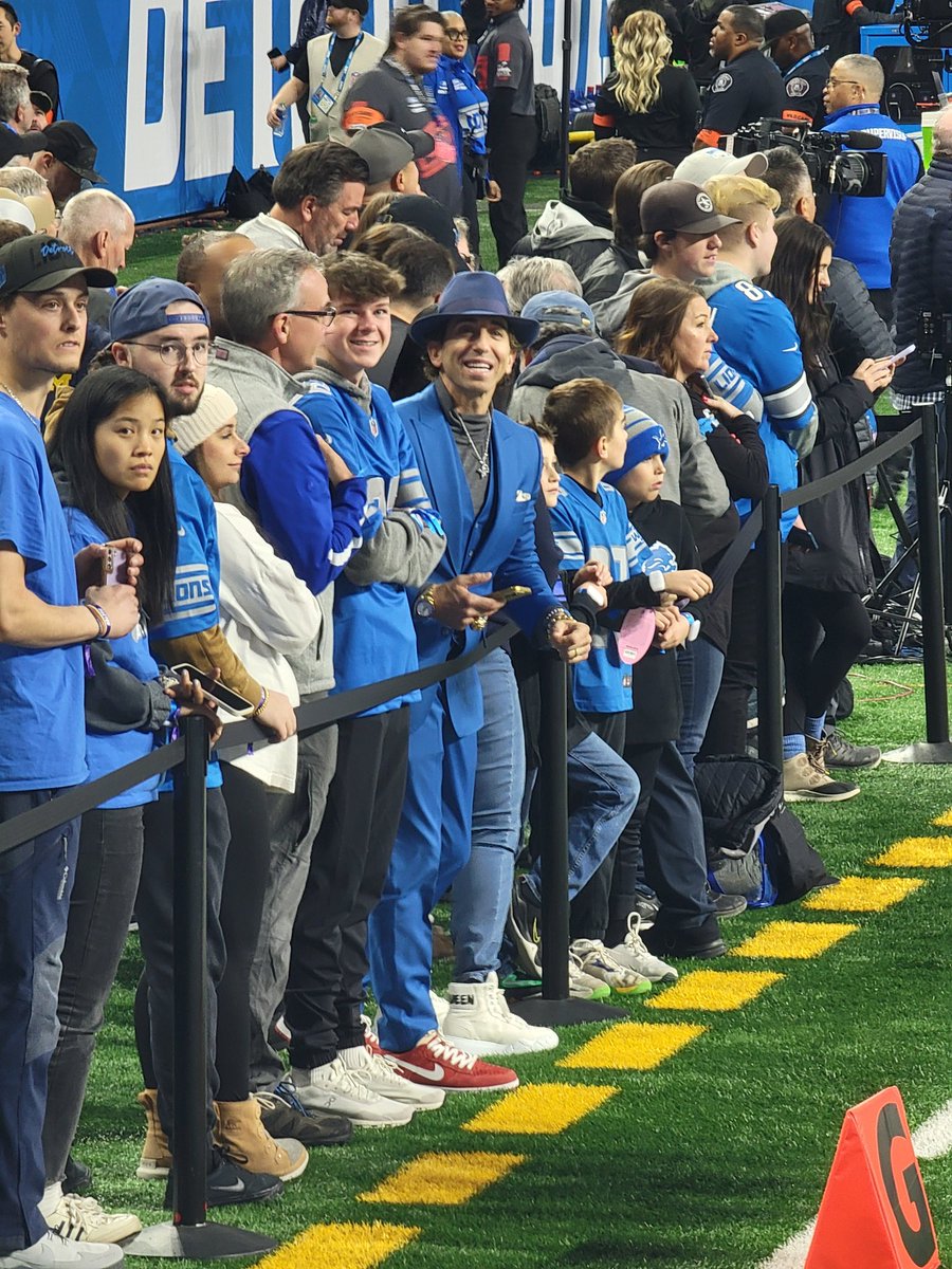 FishingWithJohn's tweet photo. I was at the Lions game last night and I was hanging out just above the endzone pre-game. The guy next to me got the attention of Tommy DeVito's agent (he was there for his client Iffy Melifonwu) and tried to get him to trade hats with him. I got this photo for you @APMike https://t.co/q8MWY9OK5L