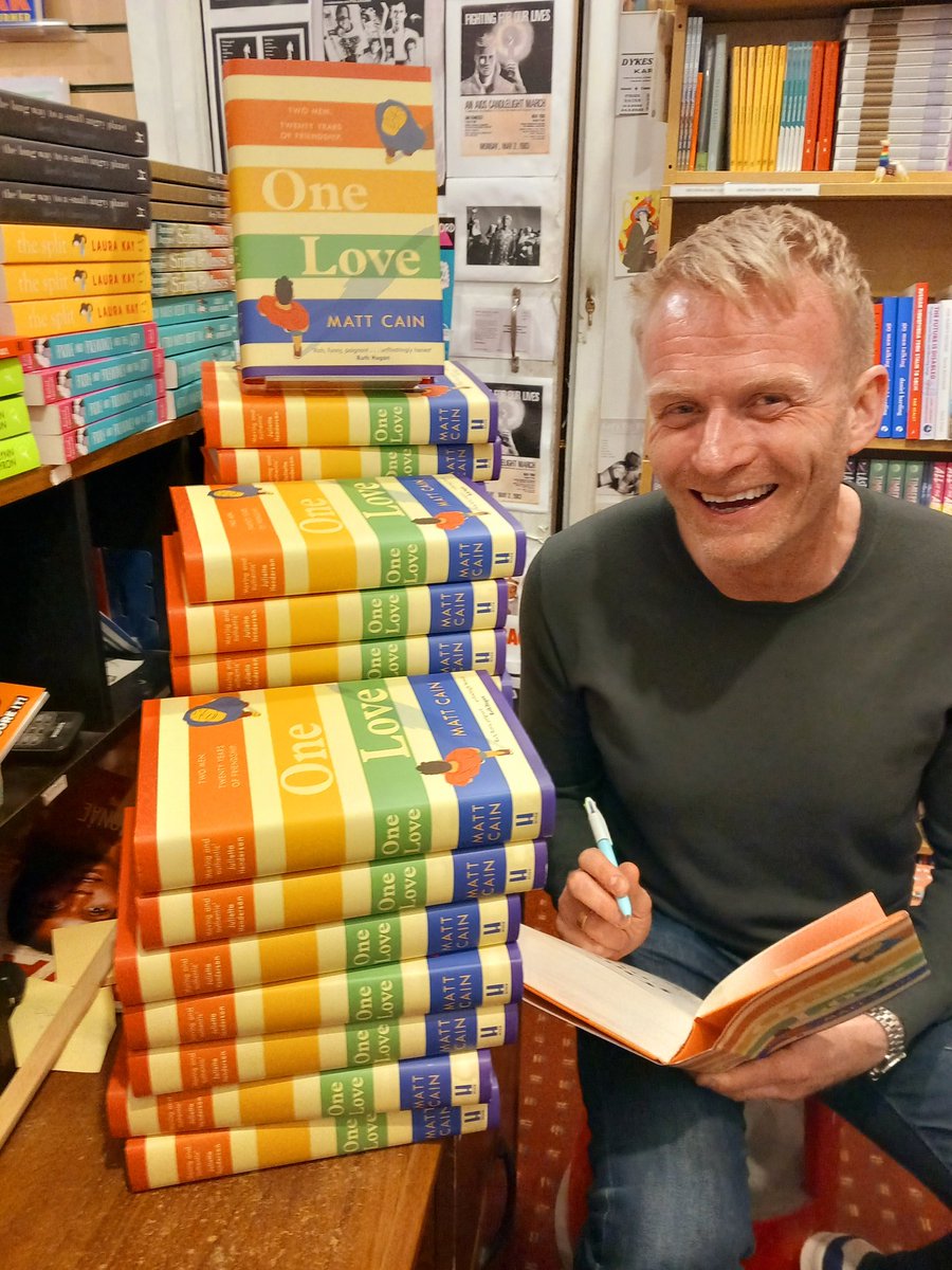 Matt Cain signing stacks of his new novel One Love which is published this week. Two men, Danny and Guy meet in Manchester in 2002. We meet them again 20 years later. Twenty years of a fabulous friendship. Danny has always nursed a secret pash for Guy. Will he tell him...?