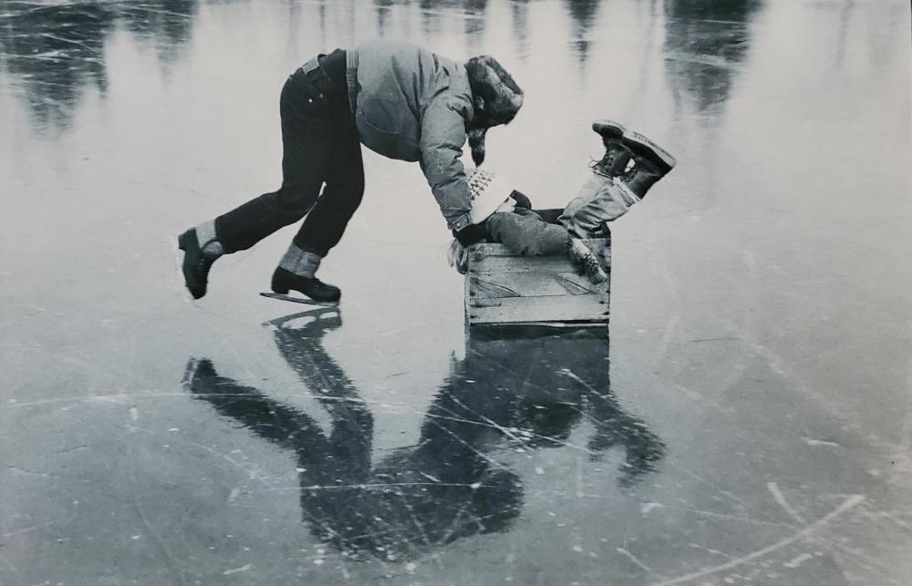 Playing on the Ice (1989) by Chicago photographer Danny Lyon (b. 1942)