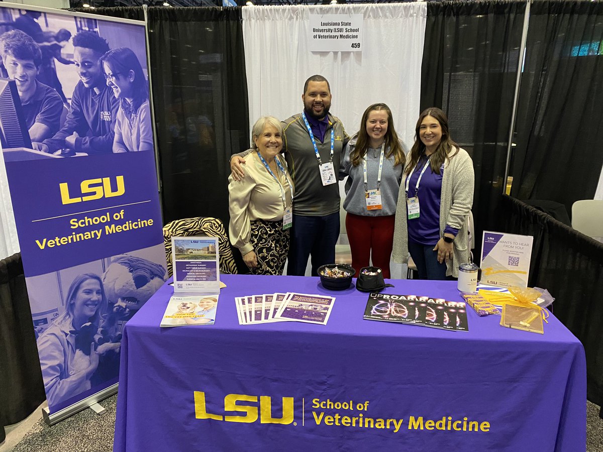 Whether canine or human, visitors to our #VMX2024 booth continue to come. Here are some wonderful images showing a canine hero loving an #LSUVetMed tennis ball; Dr. Patty Lathan, one of our amazing internists; and Annmarie Raque, an awesome student member of #VBMA. Geaux Tigers!