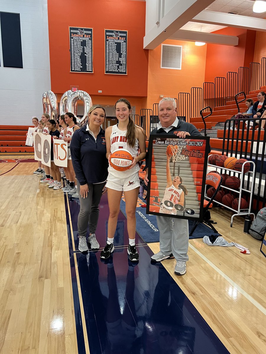 Maya Collins presented with a commemorative basketball at halftime for scoring her 1000th career point last week #sunpreps