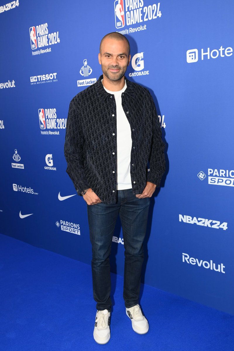 Elevated essentials. For the @NBA Paris Game 2024, @TonyParker brought his A-game in a Dior men's collection black cotton shirt with the iconic Dior Oblique print and paired it with white leather #DiorB27 sneakers featuring the same distinct pattern. #StarsinDior