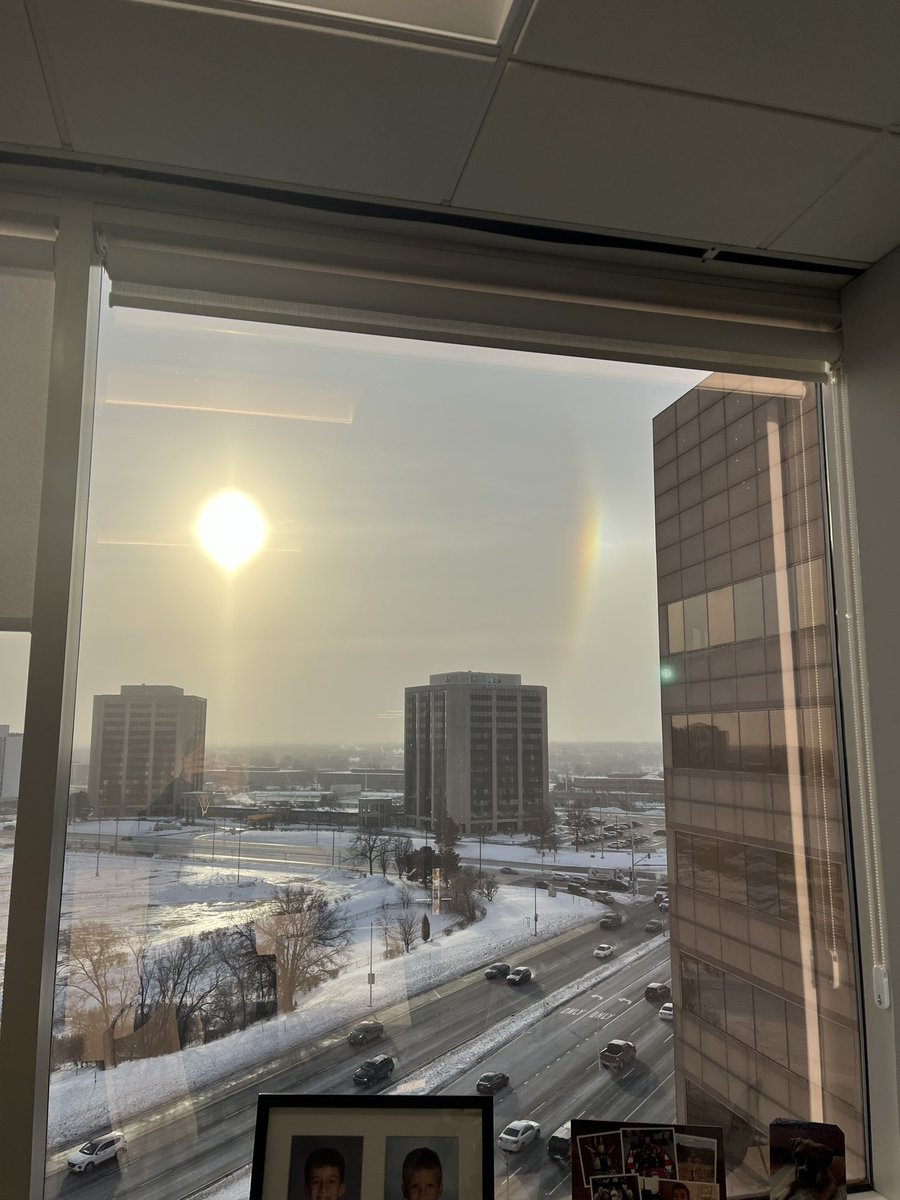 A rainbow from the cold air and ice crystals….. -29 windchill. The clouds, which also go by the name of nacreous clouds, appear only in extremely cold weather. They are created by tiny ice crystals that scatter sunlight creating little rainbows in the sky.