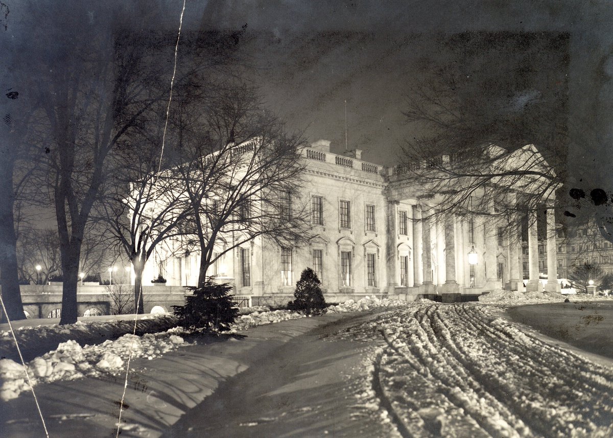 White House photographed at night, under snow, 1907: