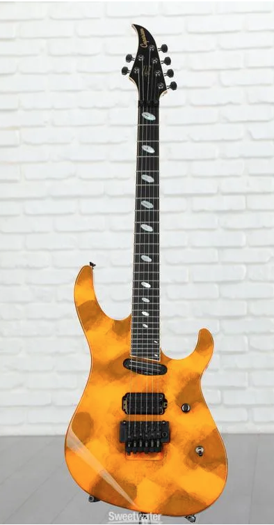 I like except the strange inlays on the fretboard and the headstock. Color is pretty cool though.