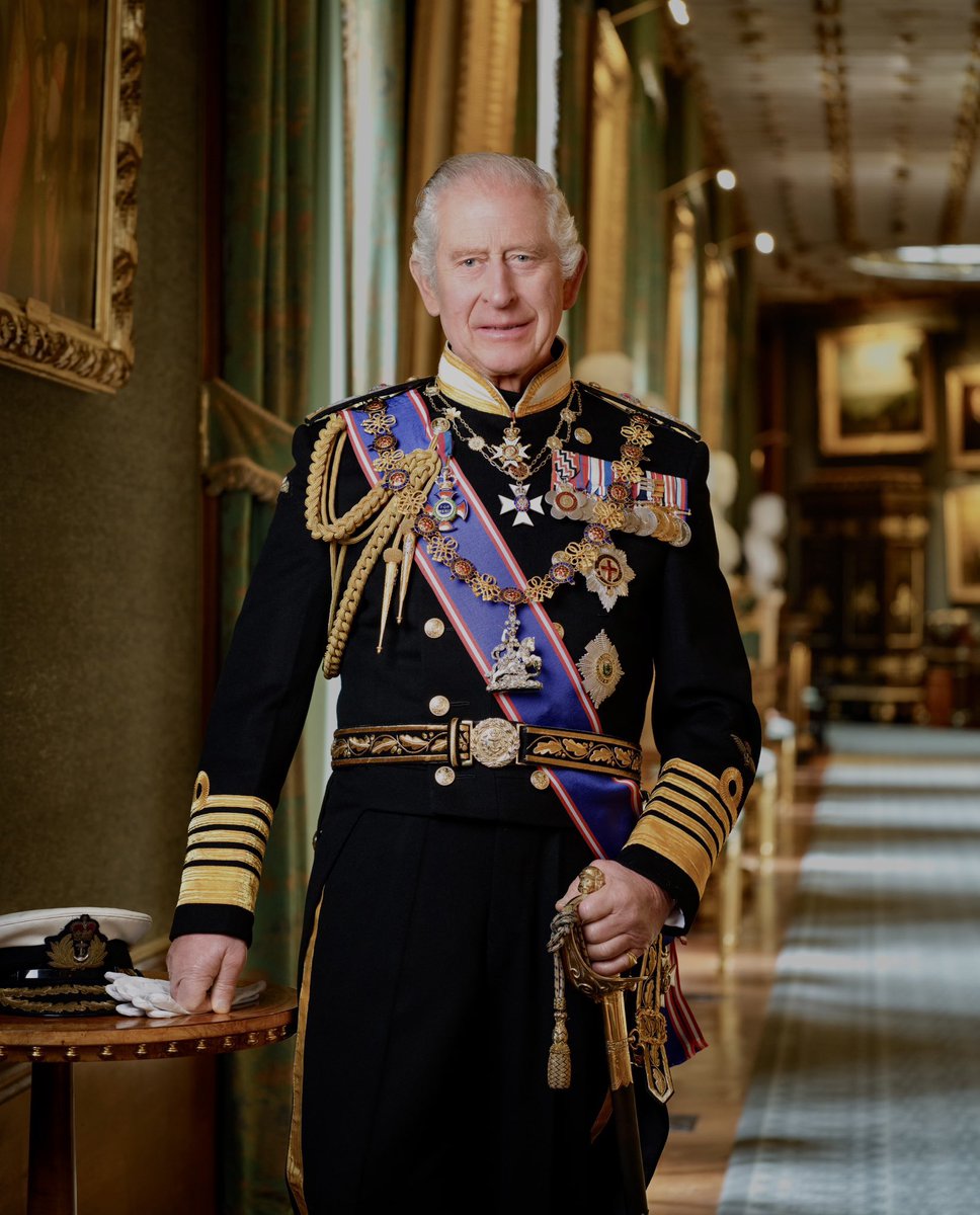 A new portrait of His Majesty The King has been unveiled for use in schools, local authorities, police and fire stations and all other public buildings. The King is wearing the uniform of an Admiral of the Fleet. The portrait was taken in Windsor Castle’s Grand Corridor.