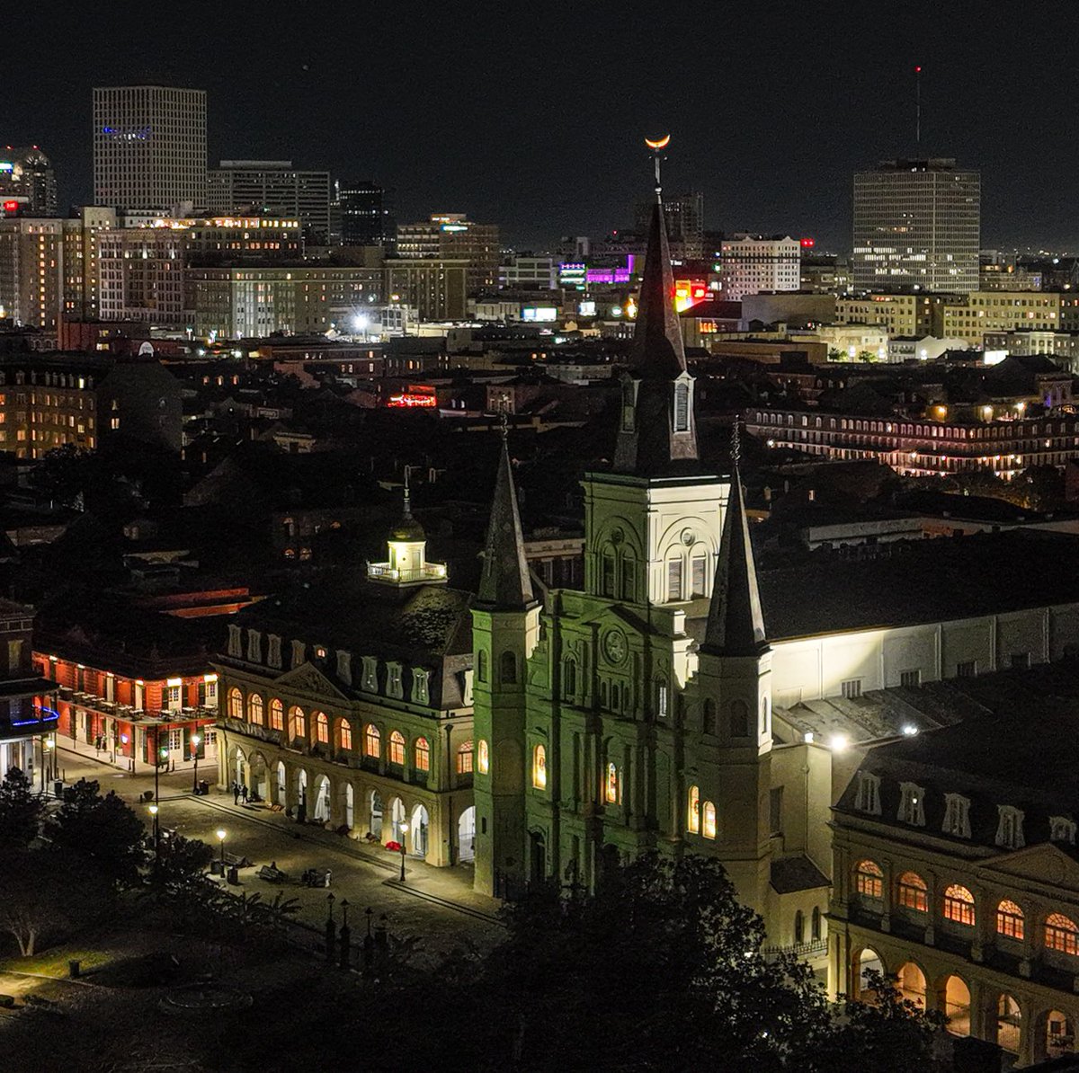 The moon rests on the cathedral's cross, New Orleans