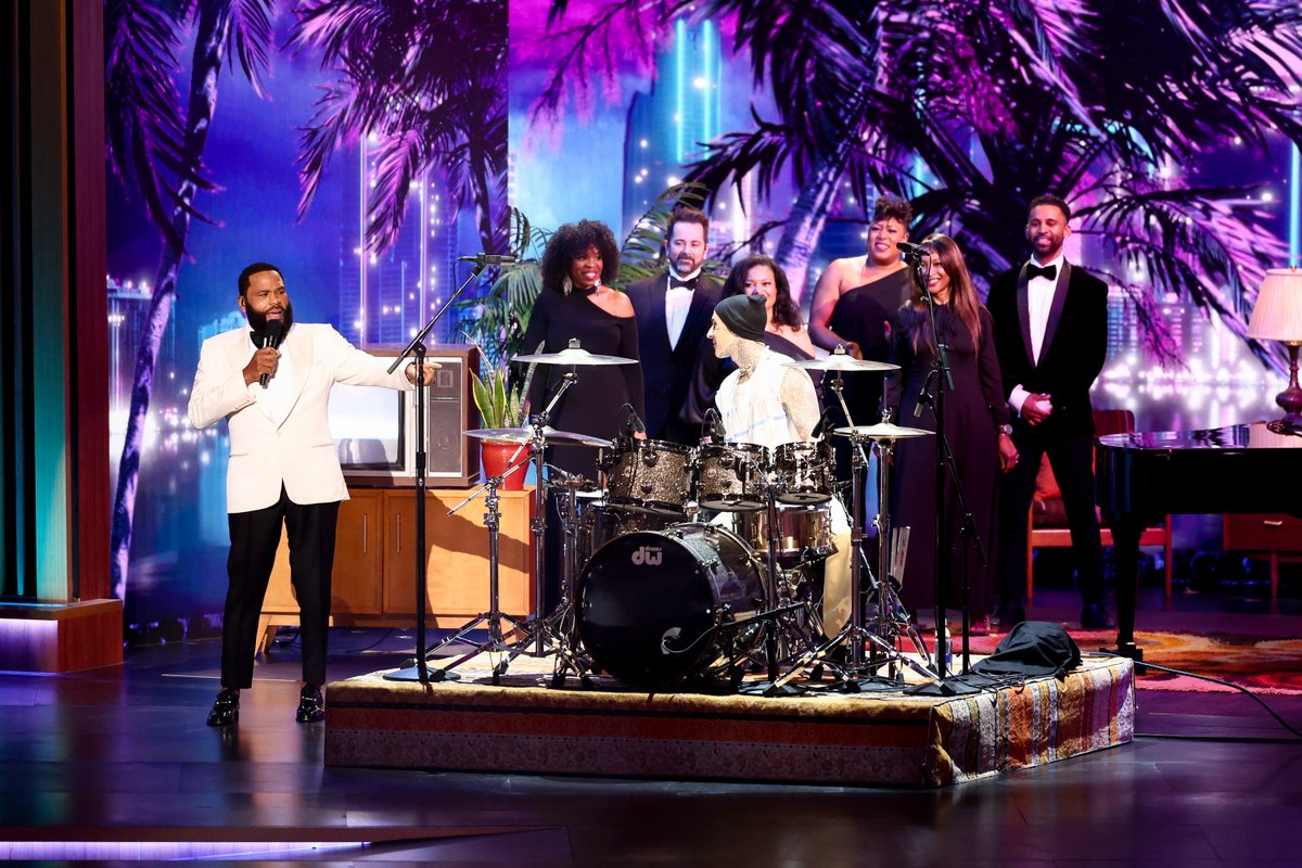 Much's tweet image. SURPRISEEEEEE!!!!! 

In case you missed it, #TravisBarker helped #AnthonyAnderson kick off the #Emmys opening performance 🥁🔥