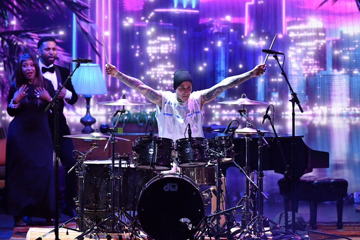 Much's tweet image. SURPRISEEEEEE!!!!! 

In case you missed it, #TravisBarker helped #AnthonyAnderson kick off the #Emmys opening performance 🥁🔥