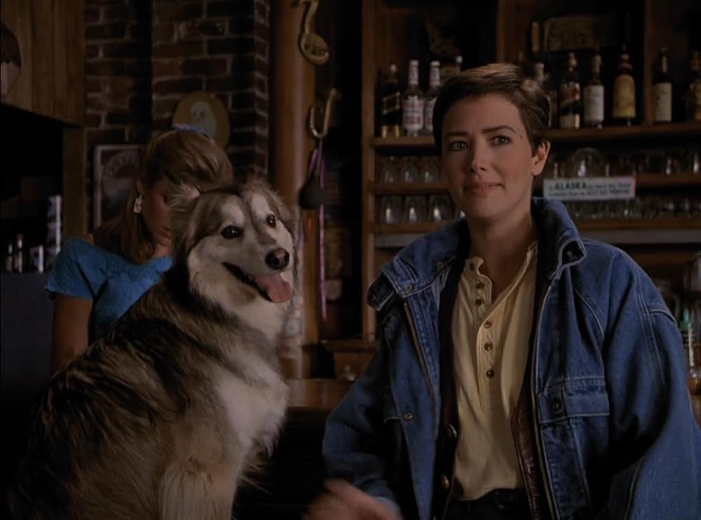 There's an episode in season 3 of 'NorthernExposure' where Maggie's bf Rick who got killed by a falling satellite comes back as a dog and they have a whole white woman in love with a dog plot line.