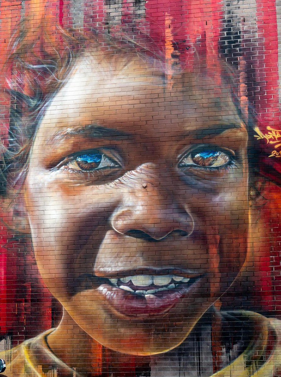 This is beautiful. In a Woolies carpark in Nowra. By Melbourne artist Matt Adnate. Stunning.