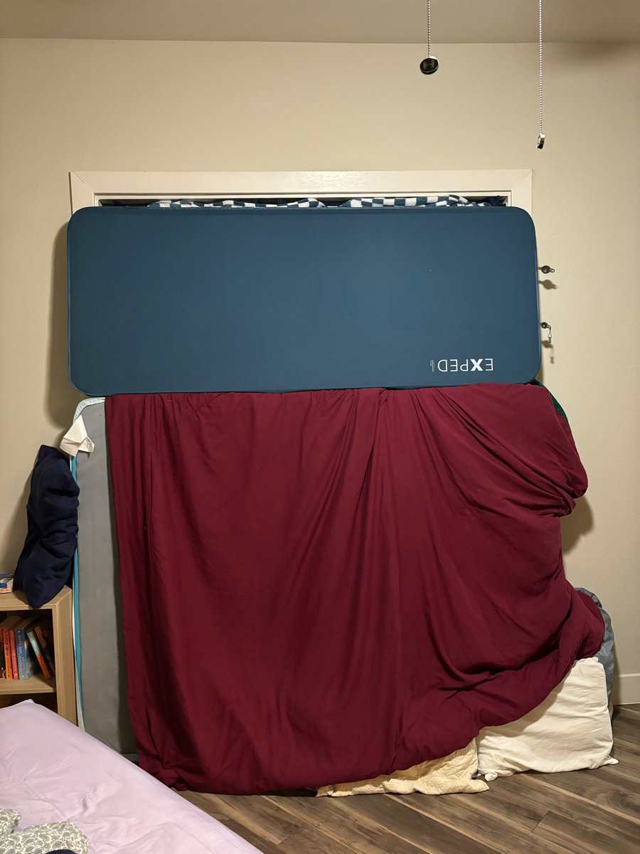 catherineealexa's tweet photo. the door to the balcony lets in a lot of cold air so we built a barricade https://t.co/SbhG8POkCp