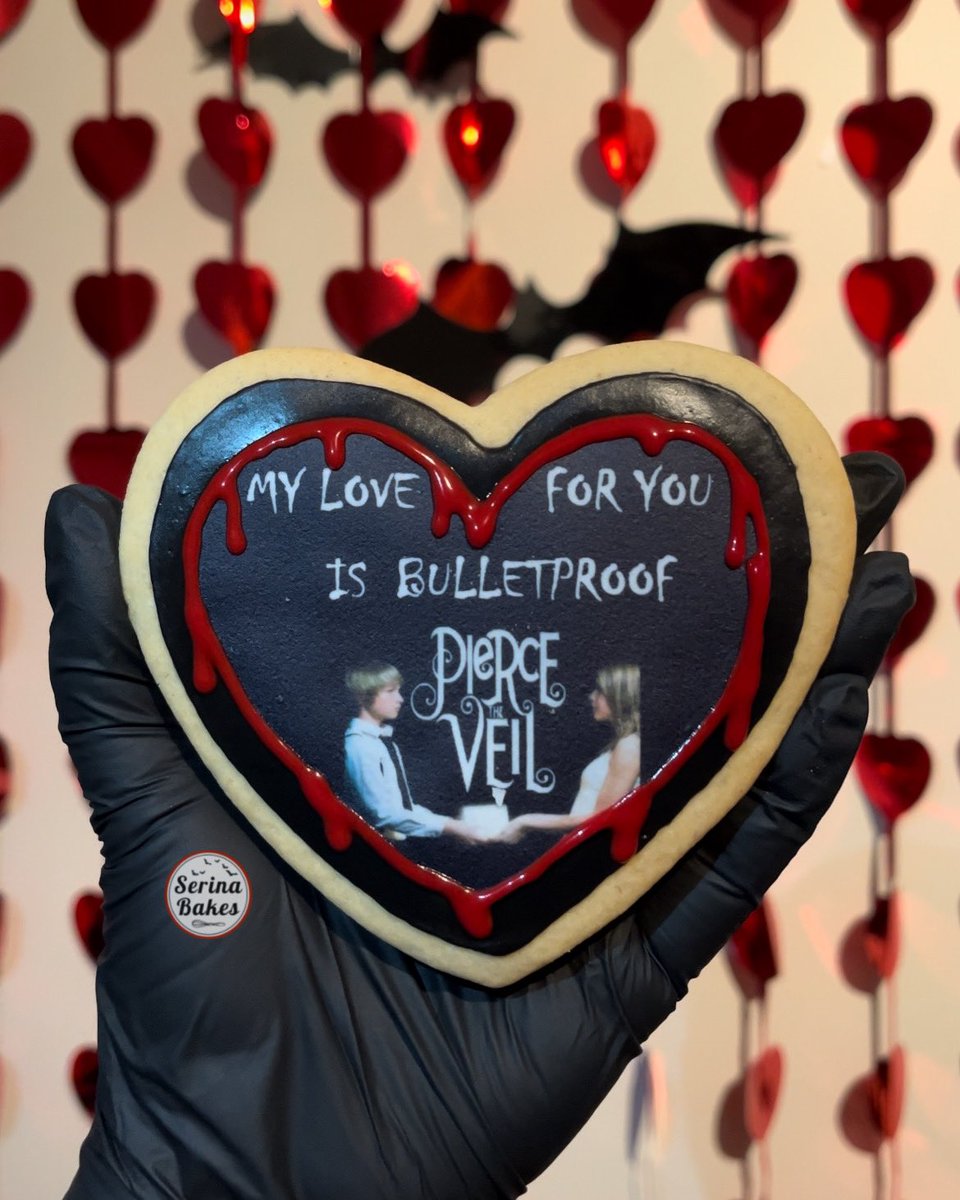 serinabakes's tweet photo. “My love for you was bulletproof, but you're the one who shot me!” ❤️‍🔥 Coming at you with an emo romance sugar cookie! 🖤 
#serinabakes #sugarcookies #heartshaped #vegansugarcookies #valentinesday #piercetheveil #ptv #alternativebaker #horrorbaker #emo #notaphase #latinabaker https://t.co/eeBIg8PSgu