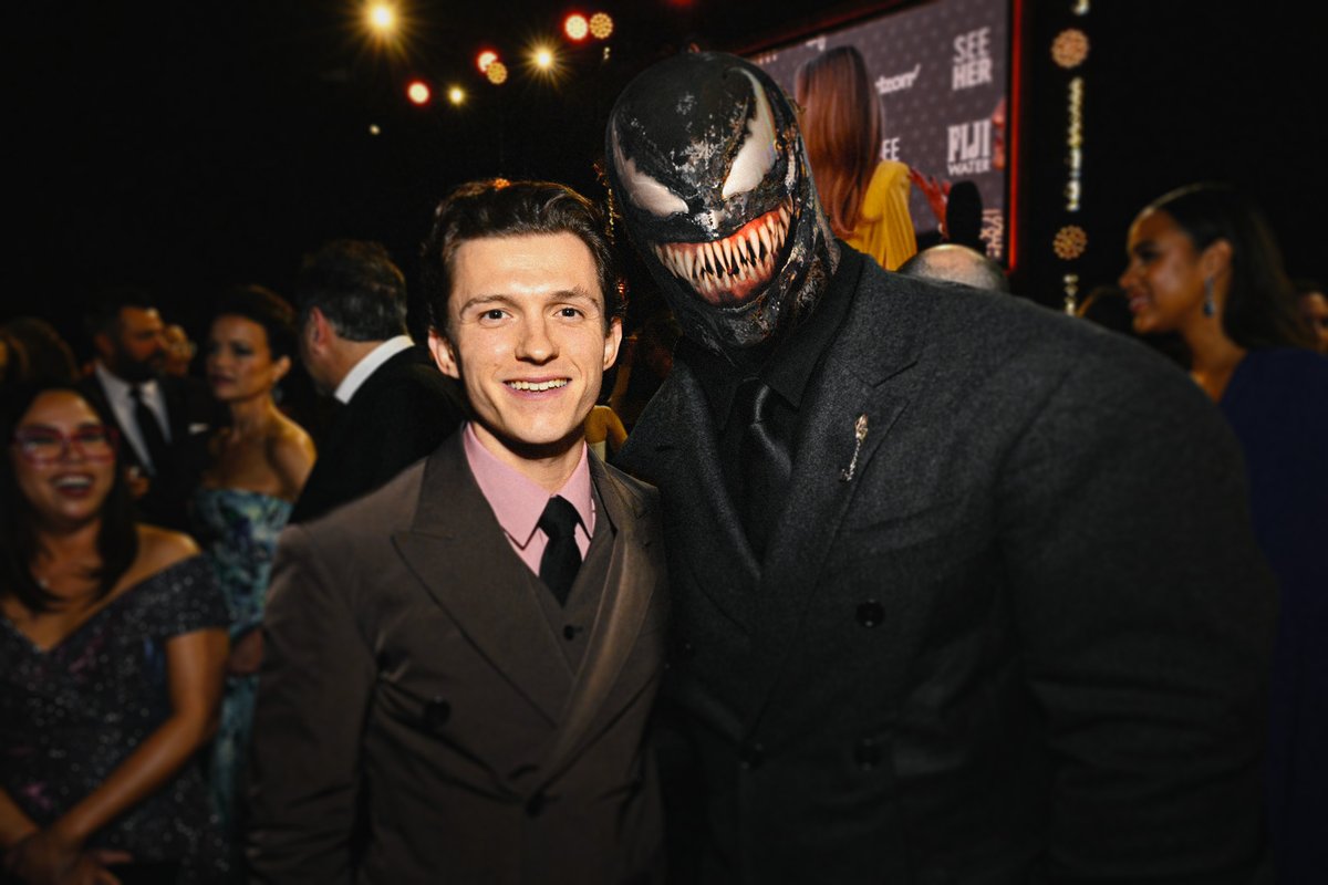 Venom and Tom Holland pose together at the #CriticsChoiceAwards