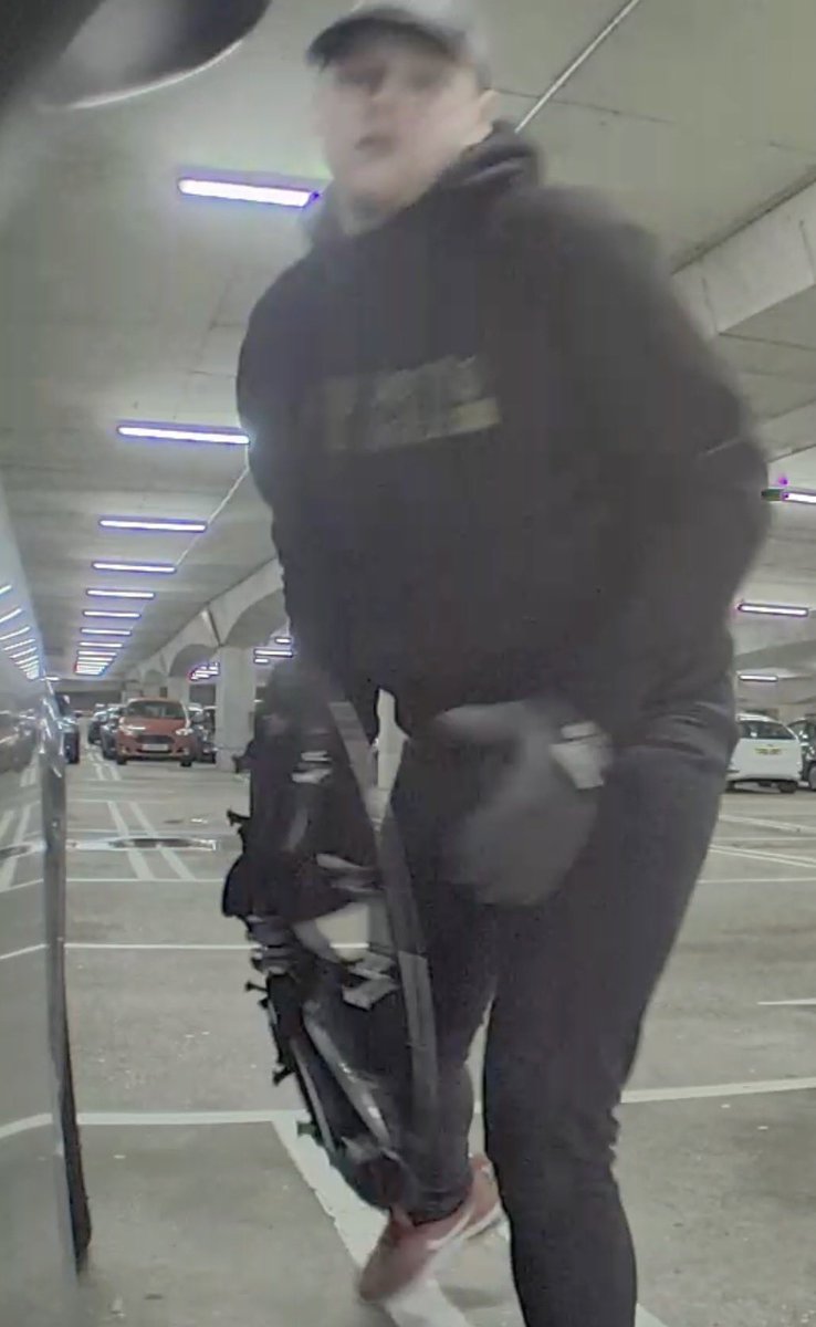 TeslaOwnersUK's tweet photo. Can anyone help make this chap famous? He’s stealing wheel covers from Bluewater in Kent but not clever enough to realise he’s on camera! The guys BMW had blacked out plates so must prowl the carparks looking for trade. If you have any info please quote 46/1363/24 to the Police. https://t.co/a1OCqQHzJy