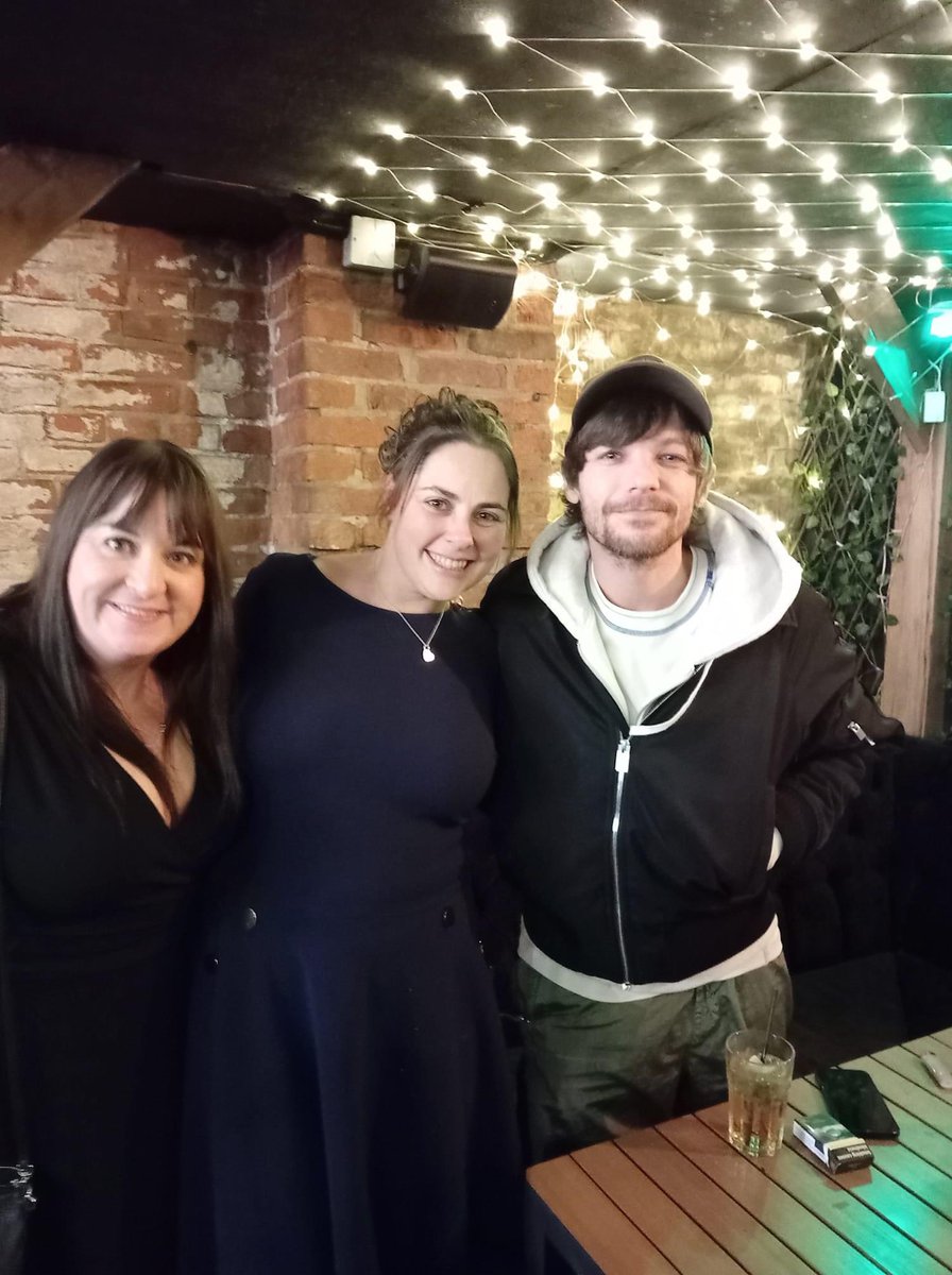 Louis posing with pictures with fans while celebrating the New Year a few nights ago. 📸: Joanne Goodlad Green