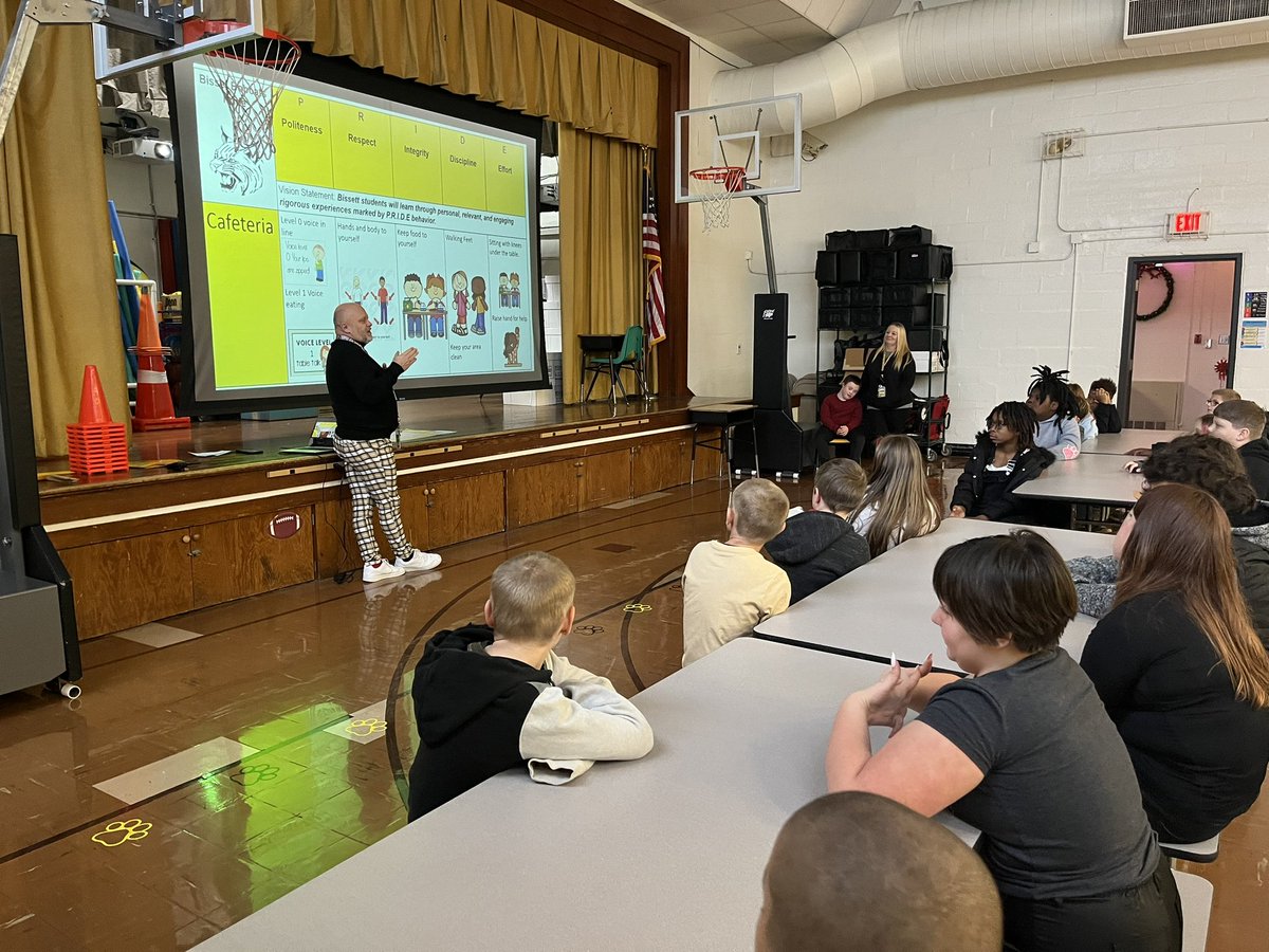 PBIS bootcamp is happening today and tomorrow.  Dr. Mitchell is reviewing Cafeteria expectations with students and practicing sitting and lining up in their new lunch spots.