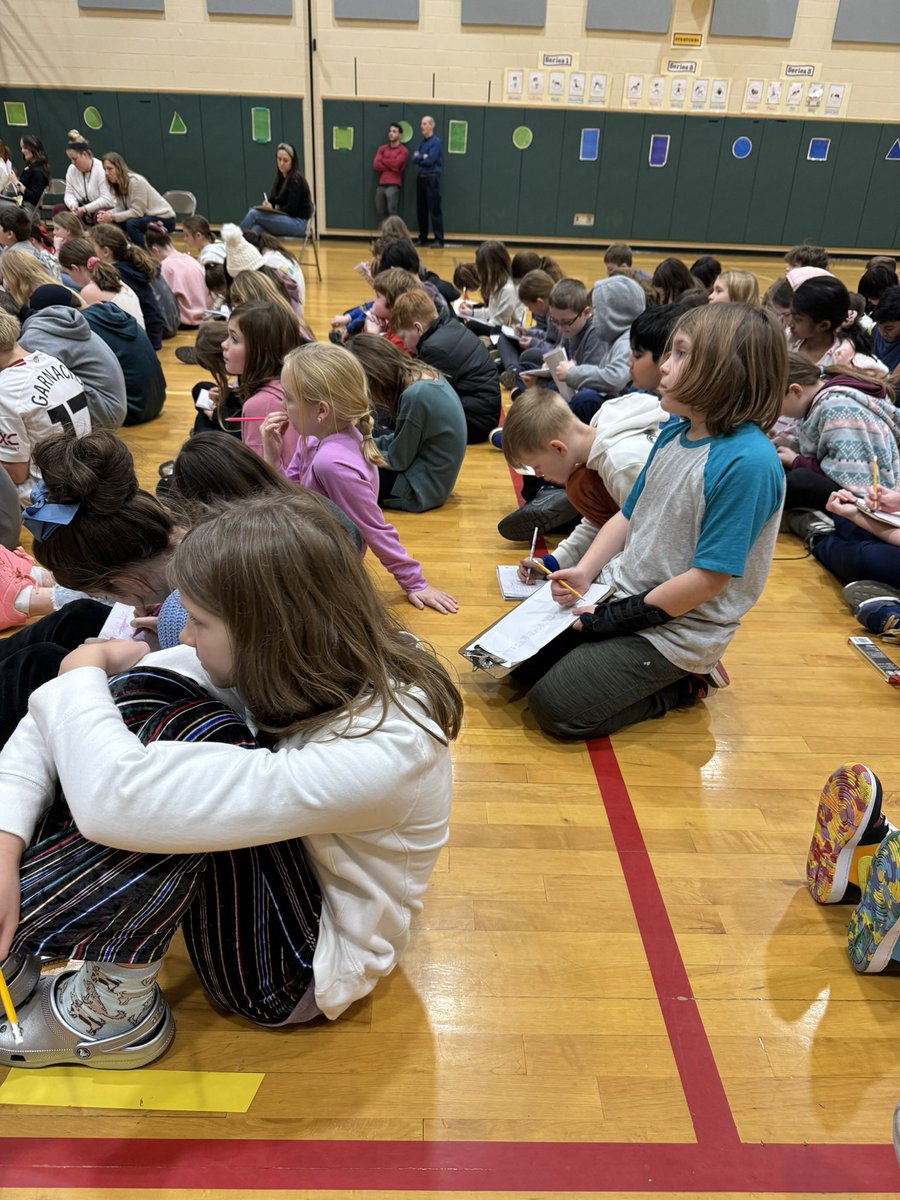 Watching the 5th graders in the spelling bee! We are writing the words down to see if we can spell them!