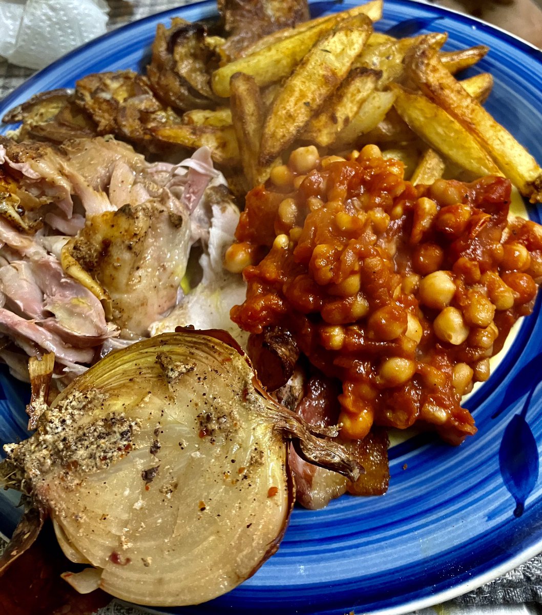 BBQ in the rain. Yeah. Why not. Roast chicken, bbq pit beans, home made chips and red onion rings in batter. #roastchickendinner #bbqpitbeans #bbqseason