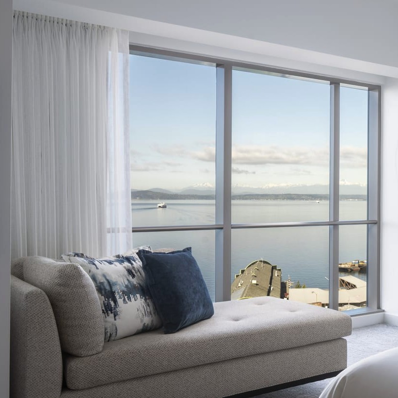 Set your sights on a waterfront getaway to reset for the year ahead. Begin with a dose of bliss while enjoying calming Elliott Bay views from your corner suite. Book in advance and receive up to 25% off: bit.ly/3tG0Bic #Seattle #2024Travel