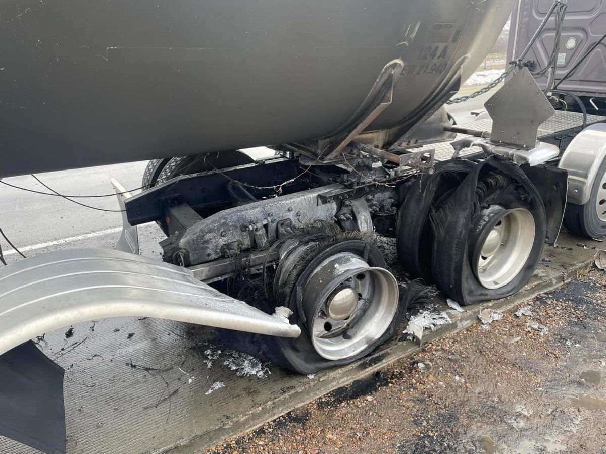 SLCScanner's tweet photo. #UPDATE #SemiFire from my earlier tweet. Quick action by Mountain Green and Morgan County Fire & EMS firefighters averted a much more serious fire situation on Interstate 84 at 11:55 this morning. Friction from a flat caused a tire fire to erupt on a 7600 gallon butane tanker. Utah Highway Patrol troopers had arrived and shut down traffic in both directions. Chief 131 arrived and determined the relief valve on the tanker had not yet operated, so the tank was not yet overpressurized. 4 tires were burning intensely. Quick application of a large dry chemical fire by the fire crews held the fire in check while hose lines were deployed. The driver had also attempted to knock back the flames with his extinguisher just as we arrived. A hose line extinguished the stubborn fire, and a Thermal Imaging Camera was employed to ensure the water had cooled the fire and the tank sufficiently. A gas detector meter was employed to ensure no gas had escaped.
South Weber Fire Department Engine 1 was requested to back up our firefighters, and Weber Fire District HazMat61 responded to assess the tank integrity and provide expertise. Weber Area Dispatch 911 & Emergency Services District provided excellent situational awareness and communication, patching together responding fire units radio channels with Utah Highway Patrol units so all responders were on the same page, closing the freeway initially, then selectively reopening lanes as more troopers arrived. A Unified Command was established when the UHP area duty supervisor reported to the fire command post. Fire units cleared the scene at 1308 after a “hot wash” quick incident review at the rest area after the road was opened. Mountain Green Fire Protection District.