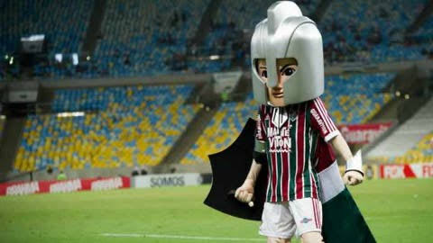 gabrielamaralll's tweet photo. @ge_flu Continuo na campanha do #ForaGuerreirinho e da criação de um GUERREIRAÇO!

O mascote do time de GUERREIROS ser esse boyzinho de condomínio que deve ir e voltar do futebol no play com meião branco ace é bizarro. https://t.co/RwtQ8Ngz6h