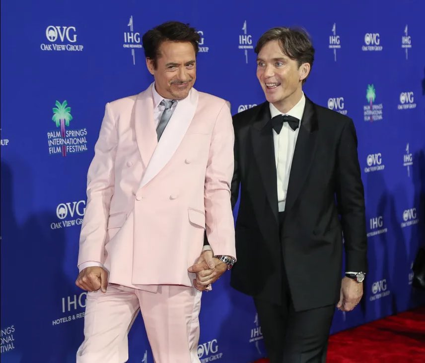 cillian murphy and robert downey jr holding hands at #PSIFF2024