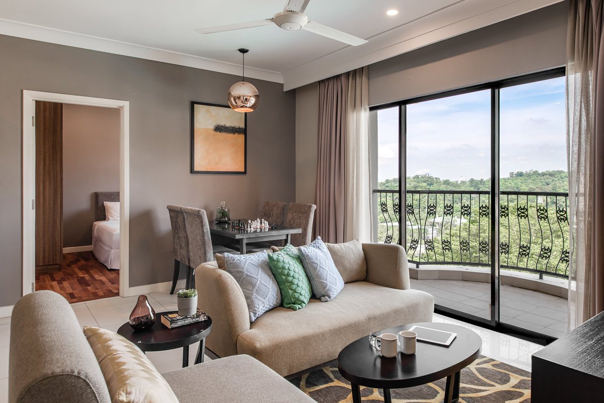 Stylish and comfortable living room with balcony at Domitys Bangsar, Kuala Lumpur, offering a blend of modern luxury and scenic views. 

@DiscoverASR 

>>>bit.ly/49T9Snm

#DomitysBangsarKualaLumpur
#BangsarApartmentsForRent
#ComfortableStay
#CozyRooms
#ModernComfort