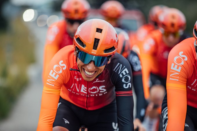 Egan Bernal in the new INEOS Grenadiers x Gobik kit. He is on bike, with a big smile.