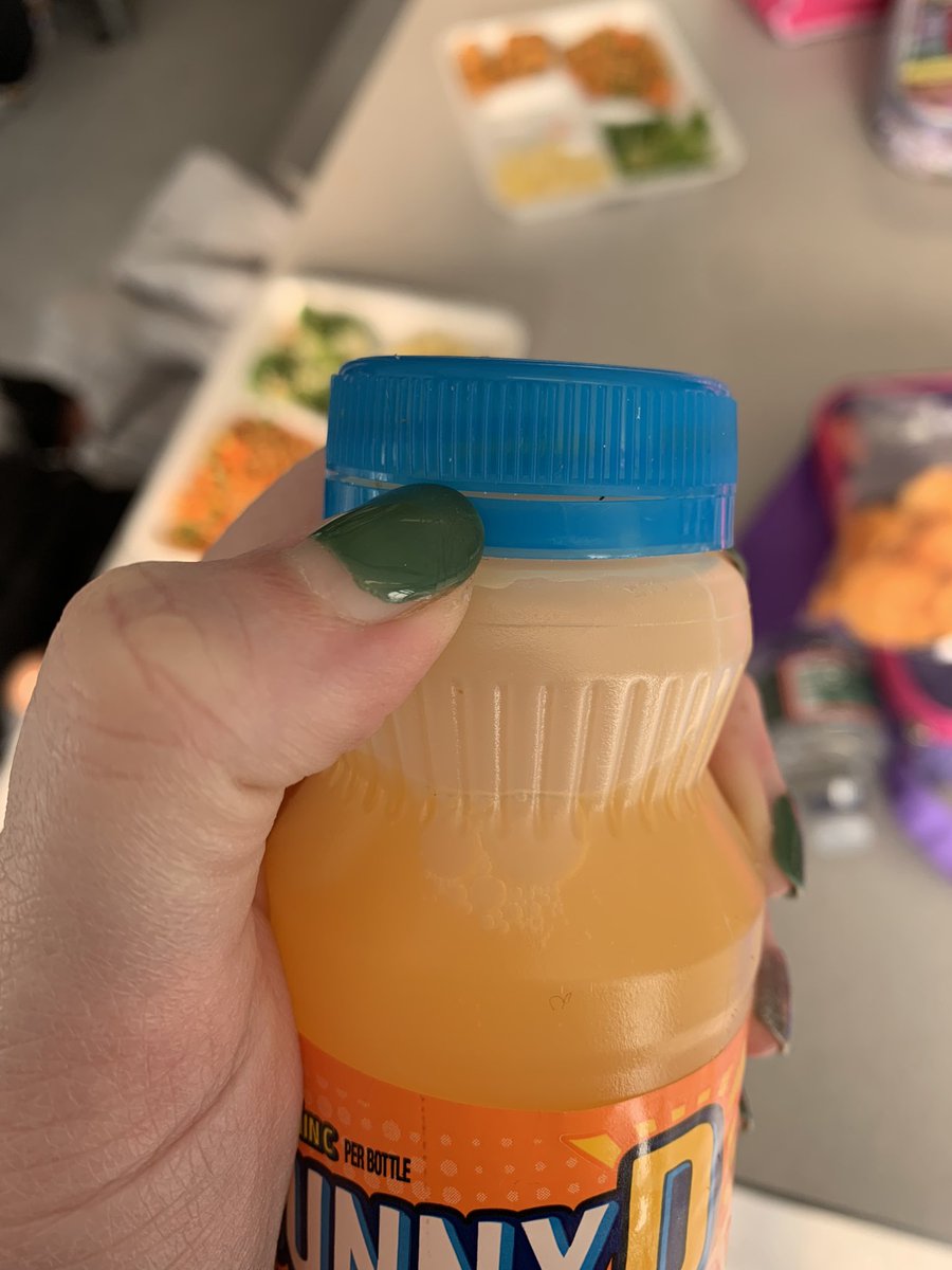 pameler417's tweet photo. Dear @sunnydelight 
Please I’m begging you, make this blue strip stick to the bottle so children can open them on their own. I spend the whole lunch period jamming my thumb into bottles and getting juice dropped on me. 
 ~ teacher who did not get a masters to be covered in juice https://t.co/btTuWS5DWA