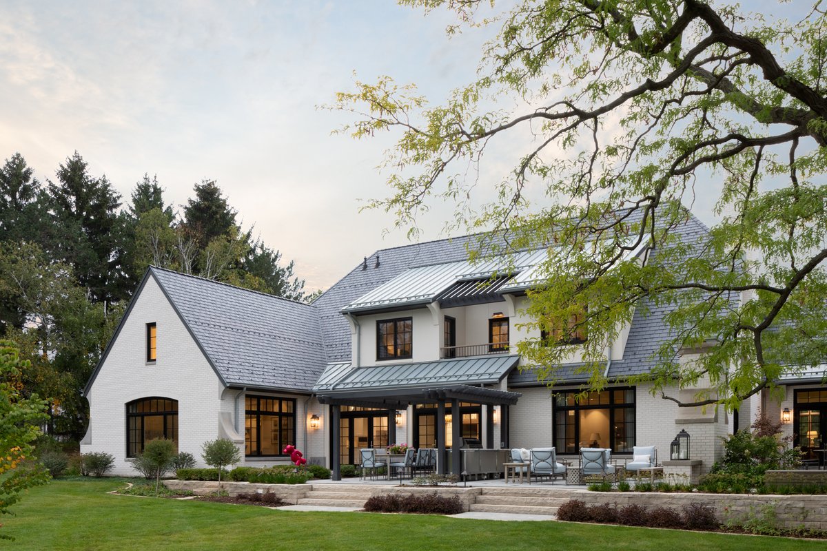 The home massing gradually reduces to engage with the surrounding mature trees comfortably embedded into the landscape. 

#backyard #yardlandscape #terrace #stonesteps #maturetrees #builtenvironment #stonesteps #chimneys #milwaukeearchitecture #deepriverpartners #outdoorliving