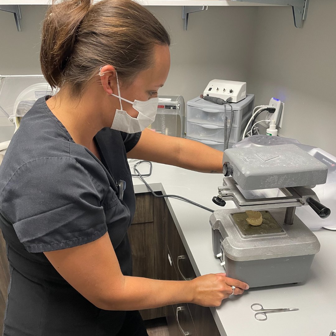 A little look behind the scenes at LDC. When you get a teeth whitening kit from us we make you a set of custom trays, like Caitlin's working on here, that have been molded to your teeth for the most effective application!
