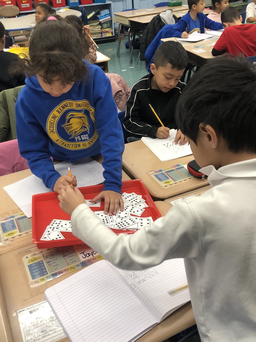 2ndGradeJKO's tweet photo. We had a lot of fun learning our new math center, “Turn Around Dominoes”. Students used the dominoes to write an addition sentence by adding the dots. They then flipped it to write the turn around fact. @PS66JKO #mathcenters #mathisfun #mathfluency #nycstudents https://t.co/j7NnI6ZEnf