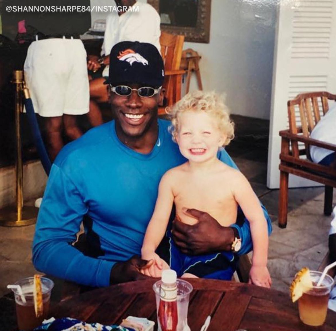 Man, this photo is beyond cool. One of the greats, HOFer @ShannonSharpe in his prime with a (wait for it)… Baby CMC! son of teammate Ed McCaffrey, NFL is family. 💜