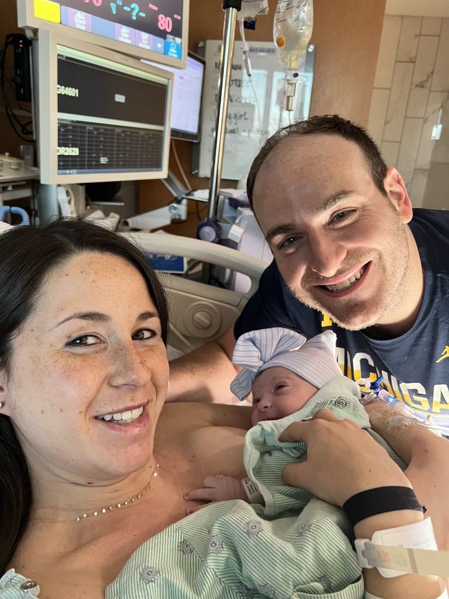 PaulStar91's tweet photo. @stoolpresidente @Gametime Dave, my wife and I are diehard Michigan fans…so much so that the stressful OT win PUT HER INTO LABOR. Because of this I can’t go to Houston but have gotten the green light from her if you pick me! Below is a pic of us celebrating the win…and 12hrs later with our newborn https://t.co/w3kuDoHPwV