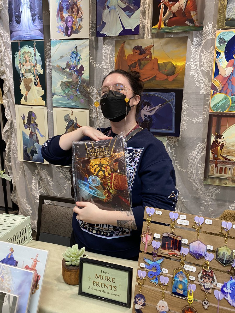 That_DeAngelo's tweet photo. I finally got to meet THE amazing @MalivethArt ! I got to give her her contributor copy of Emerald Templars! She did so much art for the book and I am so excited to have her do more art for Celestial Masquerade! 

Check out her booth at Orca Con! https://t.co/qUfflZz3rc