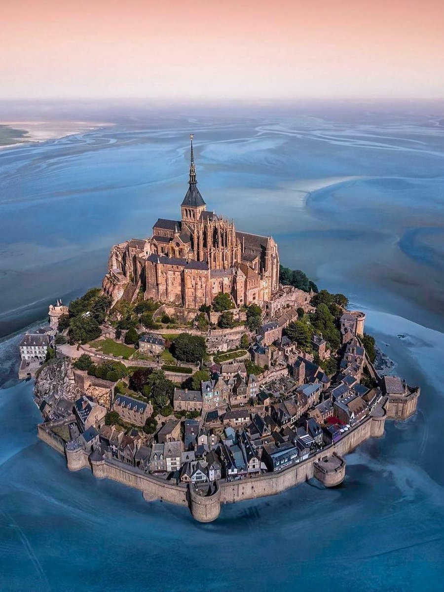 14. Mont-Saint-Michel Abbey, Normandy, France (1523) Mont-Saint-Michel, a tidal island commune in Normandy, is sometimes called the wonder of the Western world. The Romanesque-Gothic abbey is medieval, but a church of some form has crowned the mount for over 1,000 years.