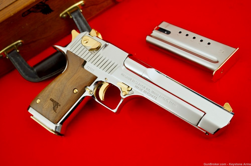 AutoMagArchive's tweet photo. IMI Desert Eagle .44 Magnum in chrome with gold accents and wood grips. https://t.co/2VSVgvrD6b