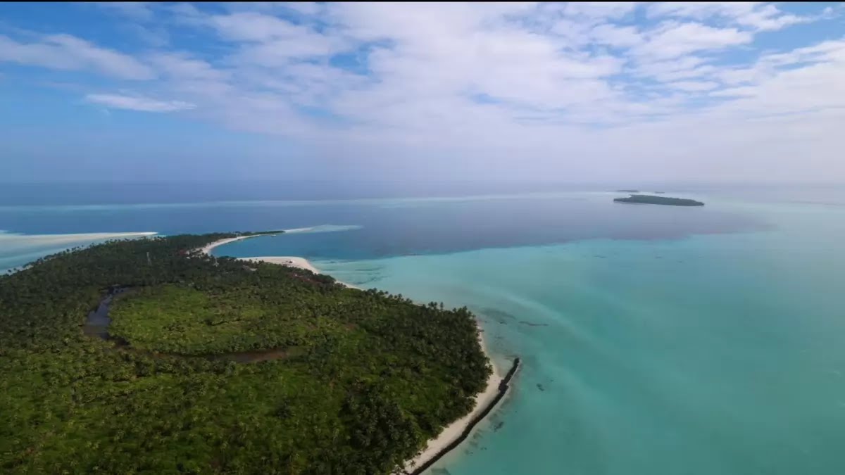 Lakshadweep Where turquoise waters embrace pristine shores in a symphony of serenity