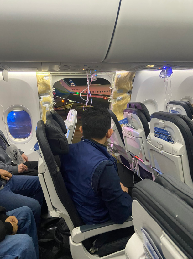 NEW IMAGE from on board Alaska Airlines 1282 after ***part of the fuselage*** blew out mid-flight. Successful emergency return to Portland after 20 minutes in the air. 10-week-old (!) Boeing 737 Max 9. NTSB investigating.