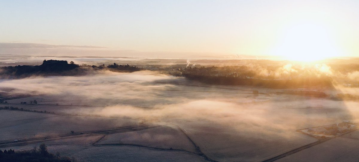 A fine sunrise this morning over Stirling. The finger of mist extends towards the Wallace monument from the castle.