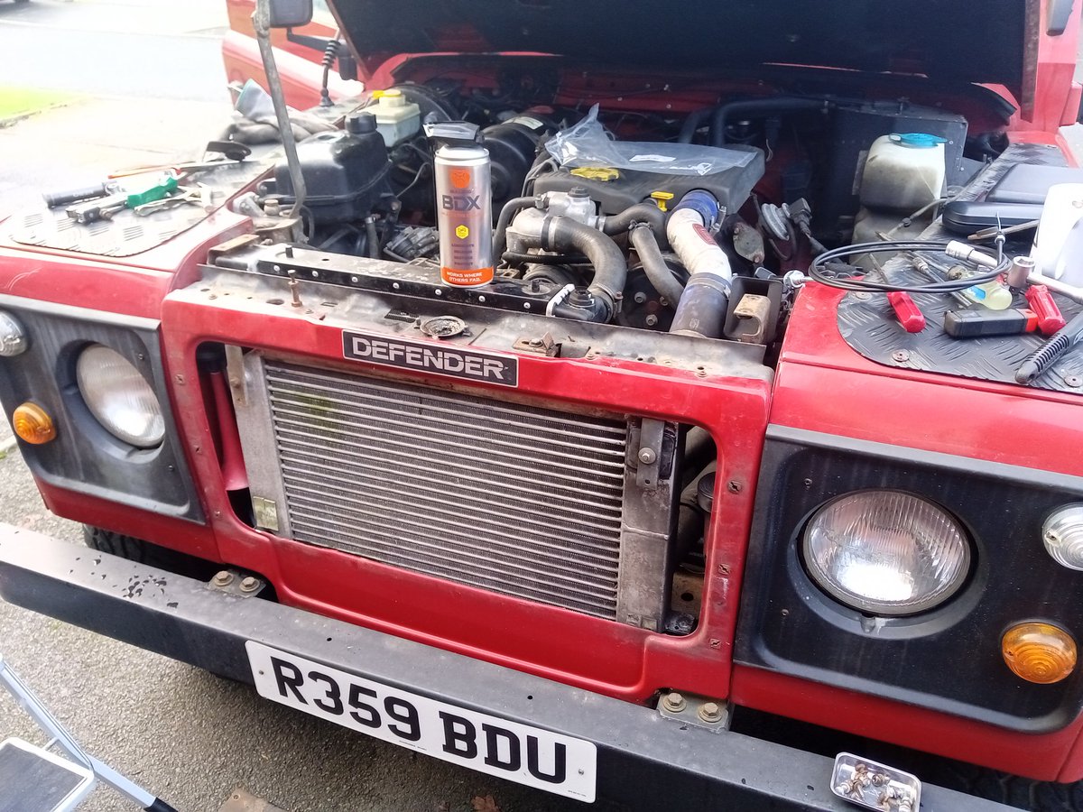 PirateArchitect's tweet photo. Replacing broken bonnet cable, fiddly old job but all done and can now open the bonnet without using a screwdriver. As usual me doing a job resulted in need for field dressing application! #defender #landrover https://t.co/gMko2Alg2k
