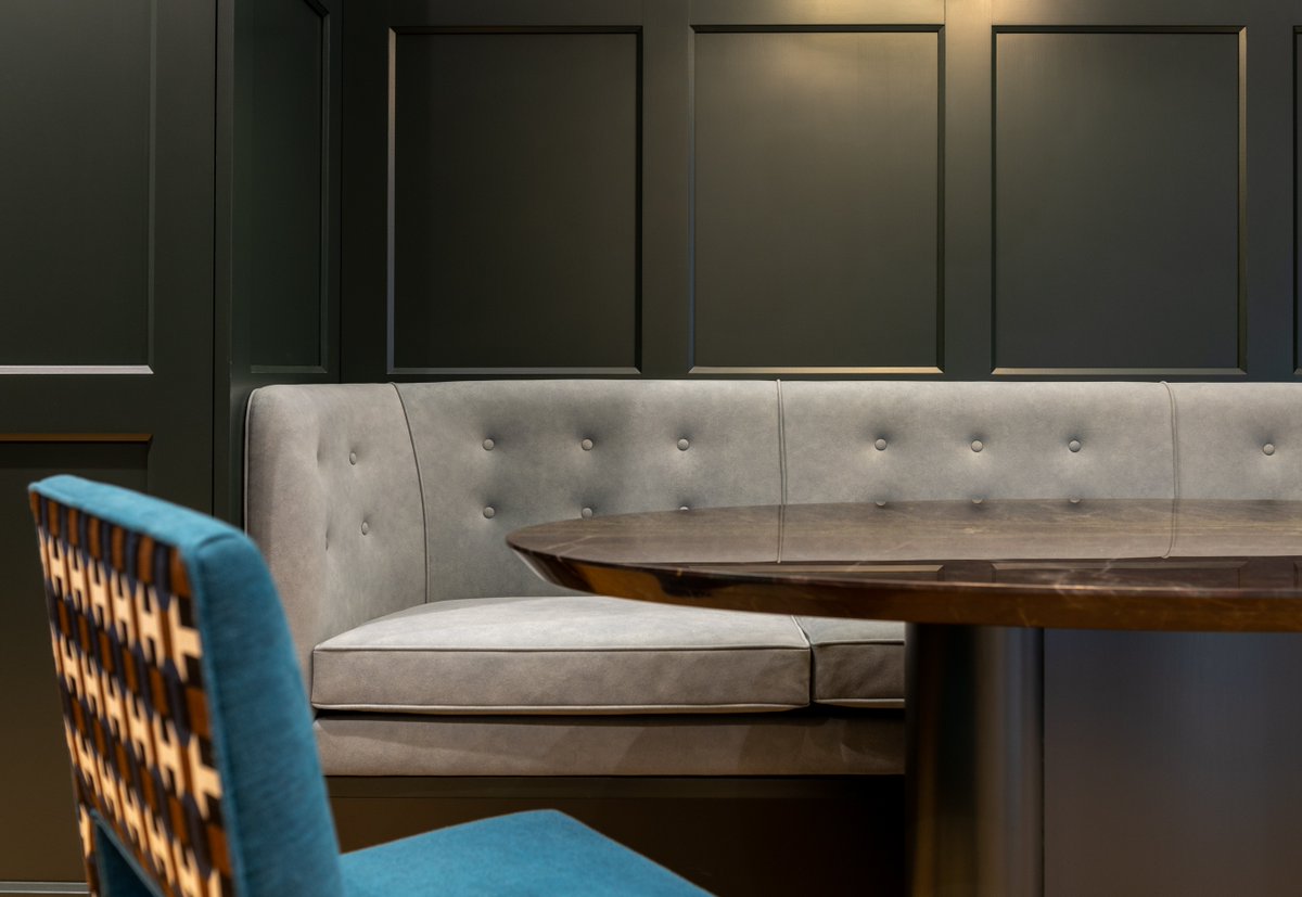 Project 6156. Three panel Catalan style wardrobe doors continue as wall panelling around the room. Factory sprayed in Farrow &amp; Ball Studio Green #dressingroomdesign #dressingroomfurniture #ultimatedressingrooms #bespokedressingrooms #dressingroomdesigners