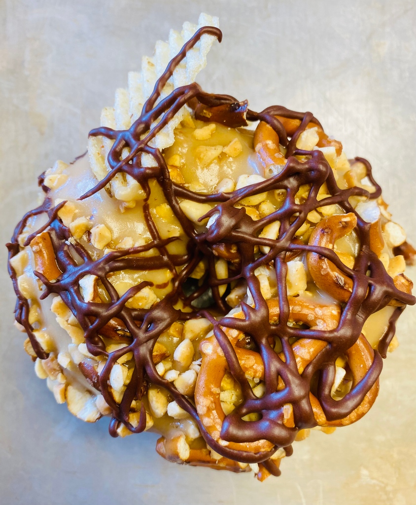 This one is worth getting out of bed for..."The Bar Snack" (v) our classic yeast-raised ring topped with caramel, peanuts, pretzels, potato chips and chocolate.