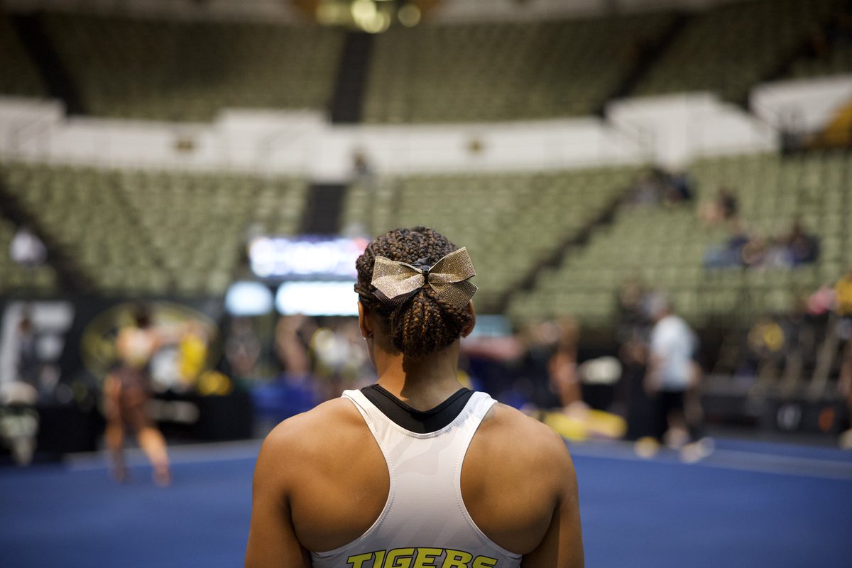 MizzouGym's tweet photo. Tonight, we compete for more than just us 🐯🦁

In solidarity with @LionsGymnastics, we are wearing Lindenwood gold ribbons in an effort to #savelindenwoodgymnastics ❤️

#MIZ🐯 https://t.co/pStSLeOfq6