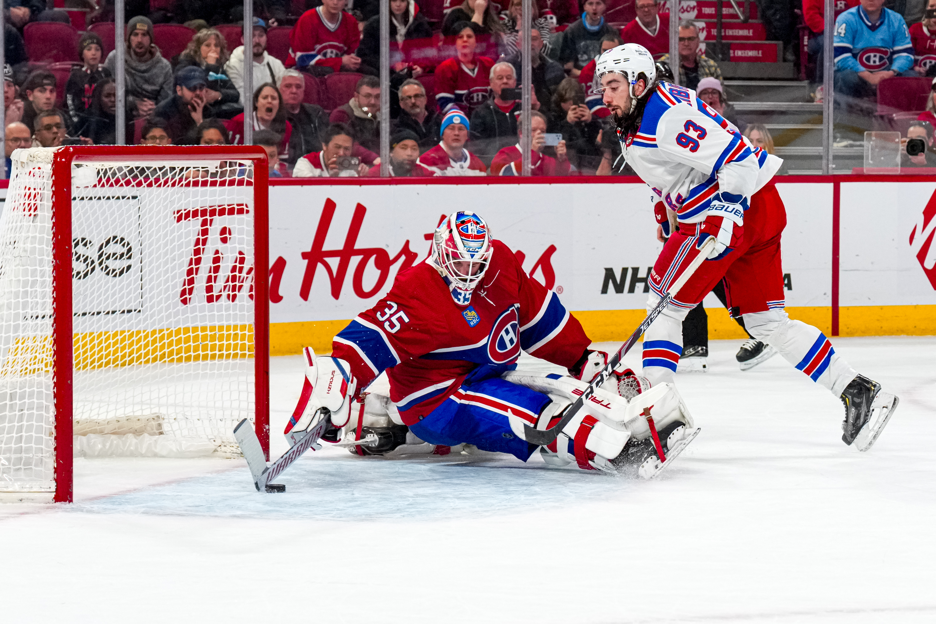Sam Montembeault sprawls out to make a save with his paddle in the shootout