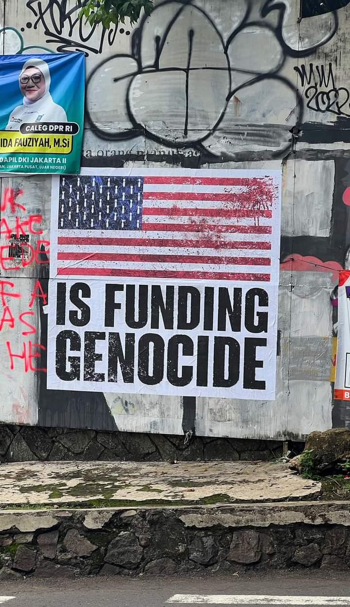 Large wheatpaste poster seen in Jakarta, Indonesia