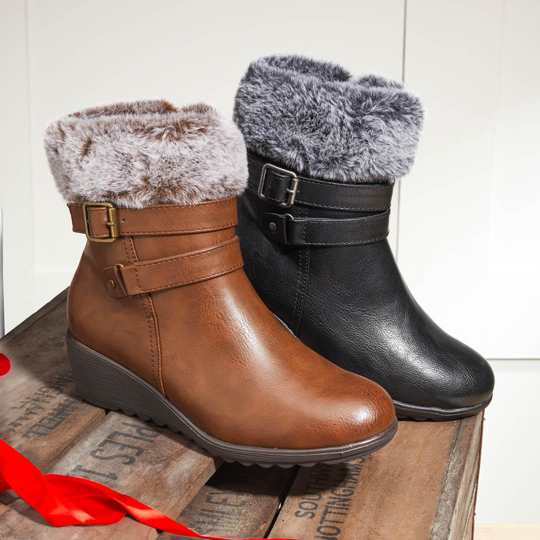 Keep cosy with these sumptuously soft ankle boots, topped off with a faux fur cuff to lock the warmth in when you need it most. Shop now: ow.ly/n6pr50Qk31M #boots #shoes #fauxfur #footwear #pavers